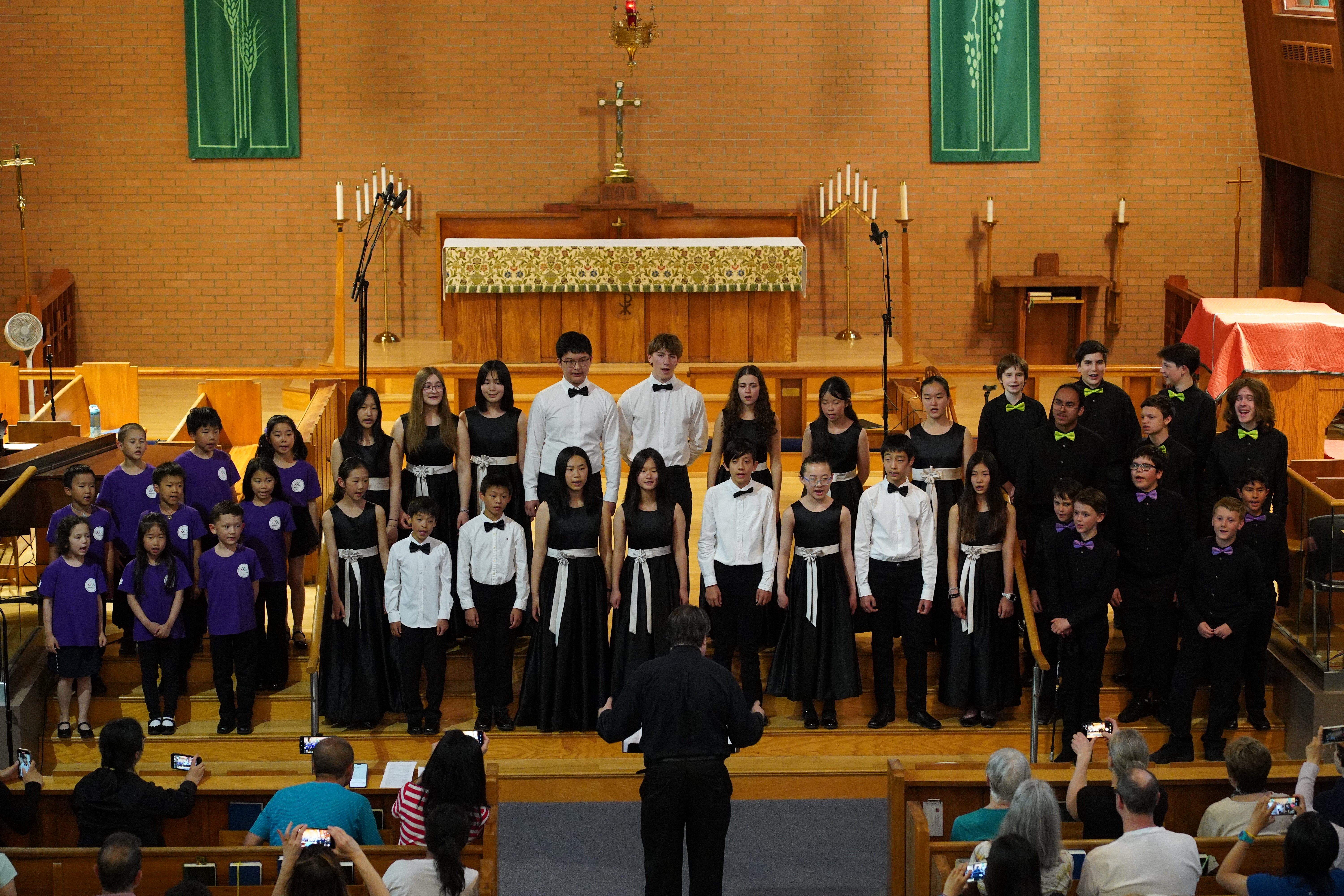 Photo of the Ottawa Boys Choir along with other choirs at a concert